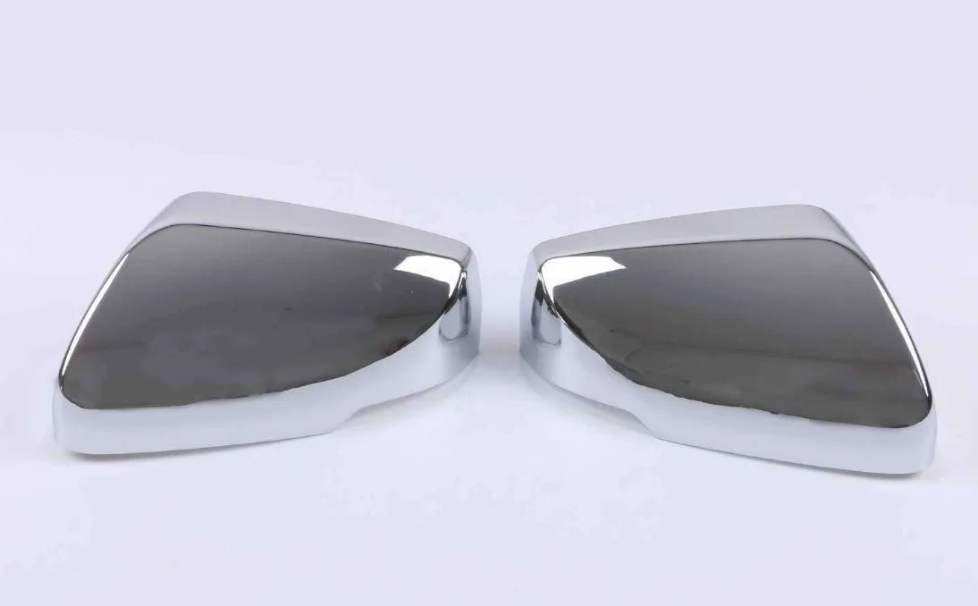 Set of ABS plastic mirror covers for Cadillac CT5 and CT6 in carbon fibre, silver, and rain frame finishes.