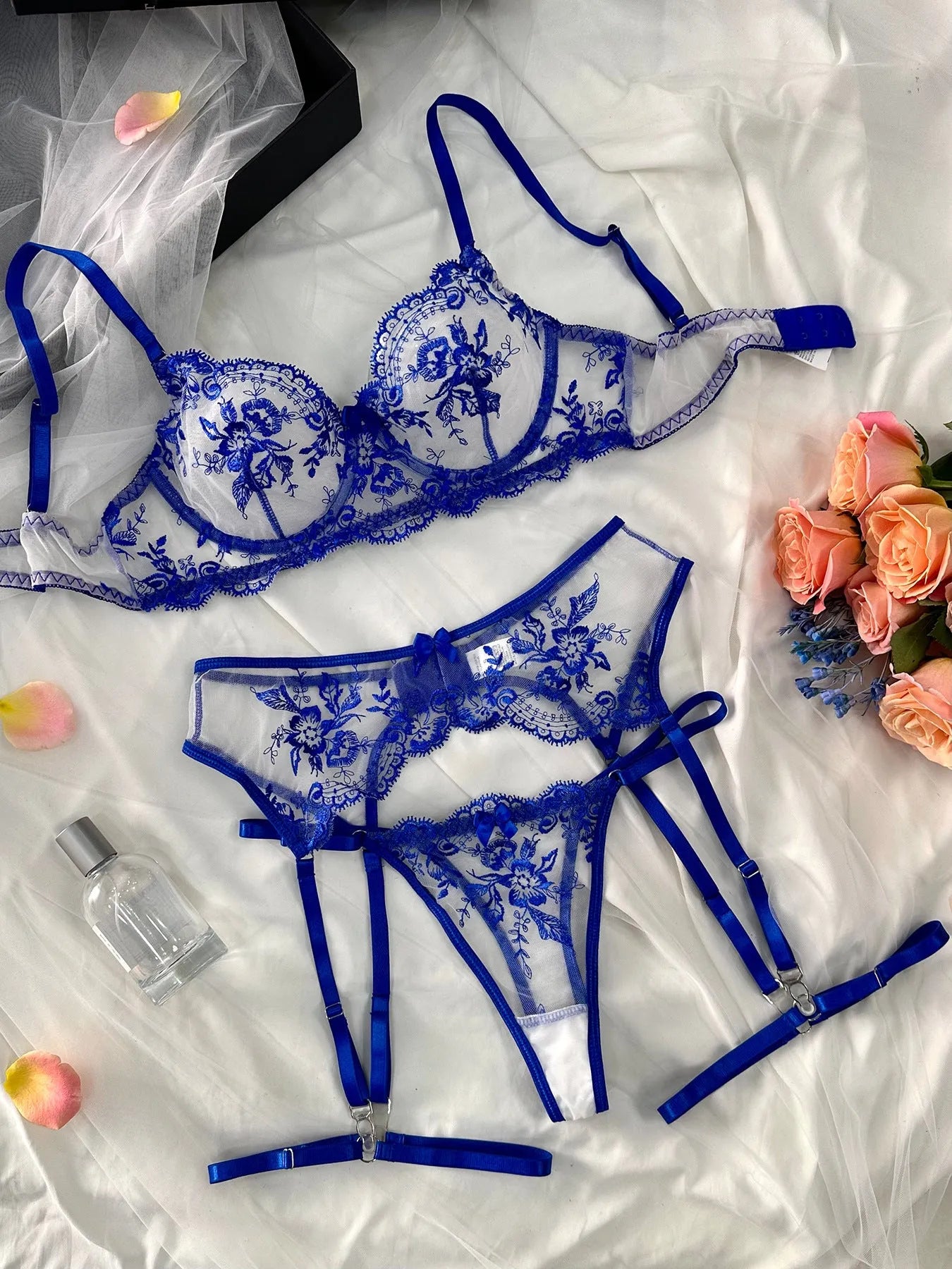 Sapphire blue women's see-through cutout underwear set with matching thong and garters