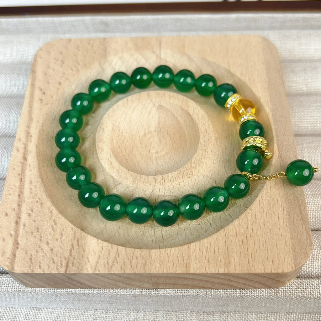 Handcrafted green chalcedony wealth snake and red agate beaded bracelet with copper components.