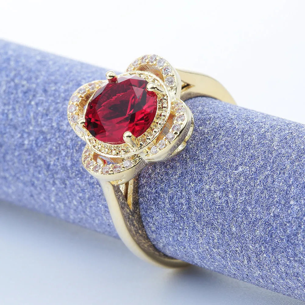 Copper fruit-shaped ring with zircon detail, showing electroplated finish.