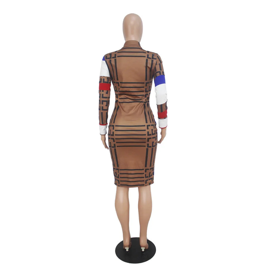 Multicolor mosaic geometry pattern long sleeve printed dress with zipper closure on a woman against a white background.
