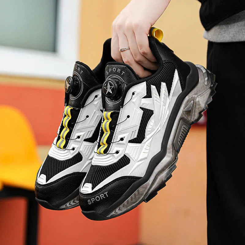 Men's black rotating button dad sneakers with mesh upper and platform sole on a white background.