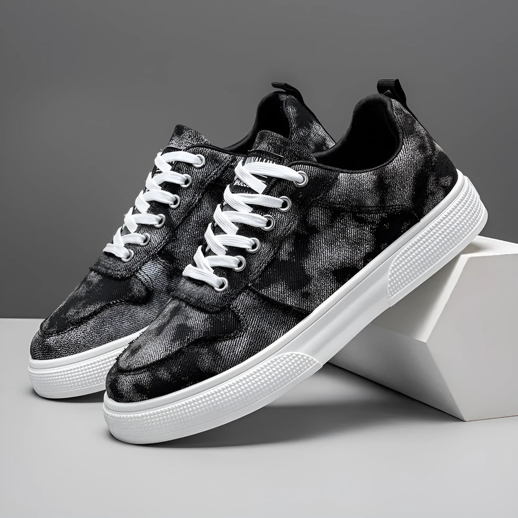 Men's low-top blue canvas sneakers with white platform sole and lace-up front.