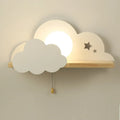 Glass cloud-shaped decorative wall lamp in grey, mounted beside a bed.