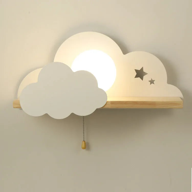 Glass cloud-shaped decorative wall lamp in grey, mounted beside a bed.