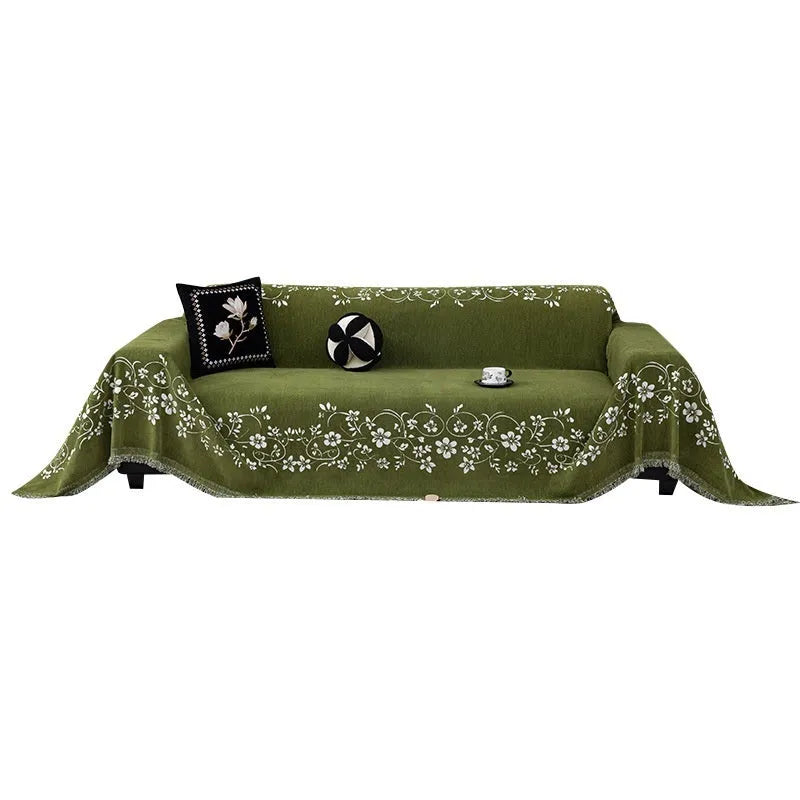 Embroidered magnolia chenille sofa cover in Garland-Black, 180x130cm, with soft texture and floral pattern.