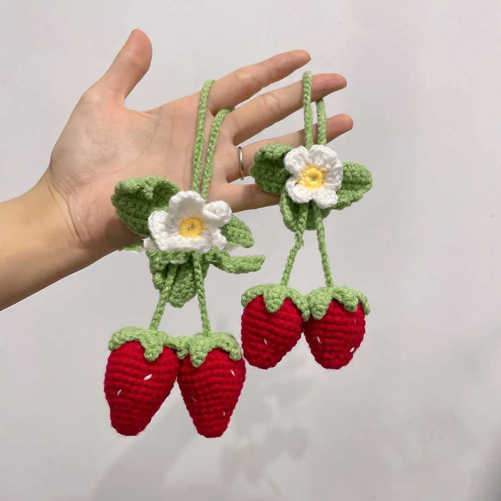 Handmade strawberry-shaped weaving pendant for car decoration, made from cotton and hemp yarn.