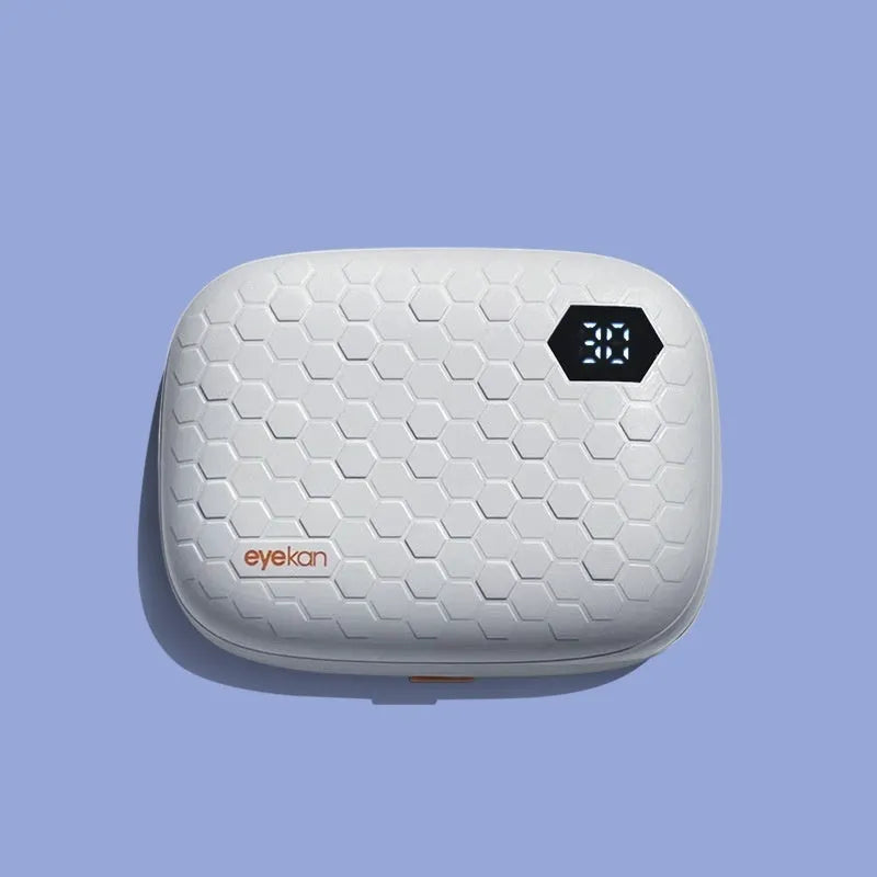 Pearl white automatic ultrasonic flushing instrument for cleaning glasses on a table.