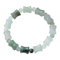 Simple beaded bracelet with a diamond-cut Tianshan Emerald chalcedony stone and coconut shell beads on an elastic band.