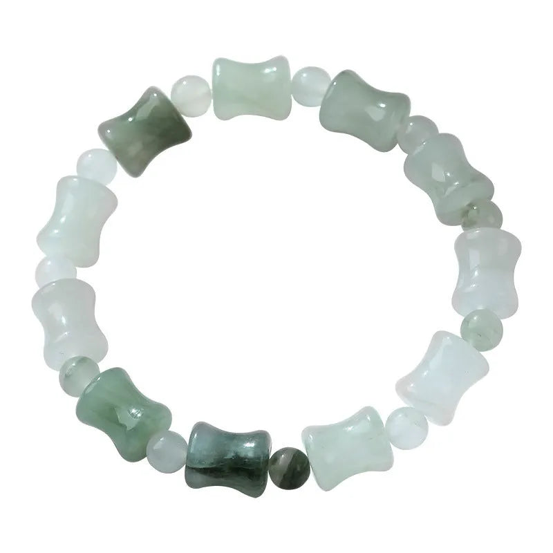 Simple beaded bracelet with a diamond-cut Tianshan Emerald chalcedony stone and coconut shell beads on an elastic band.
