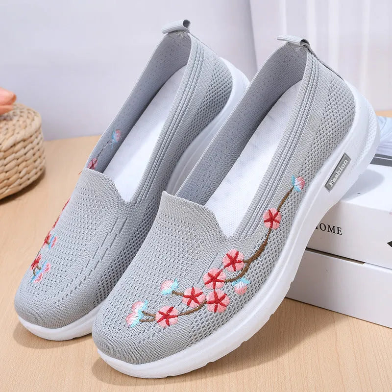 Women's woven floral embroidery casual pumps with a low heel and round toe in wine red colour.