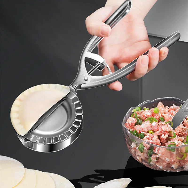 Silver stainless steel dumpling mould with handle for manual kitchen use
