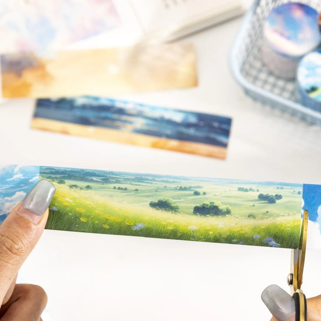 Japanese paper decorative tape roll with sky-themed designs including colourful clouds and purple nebulae