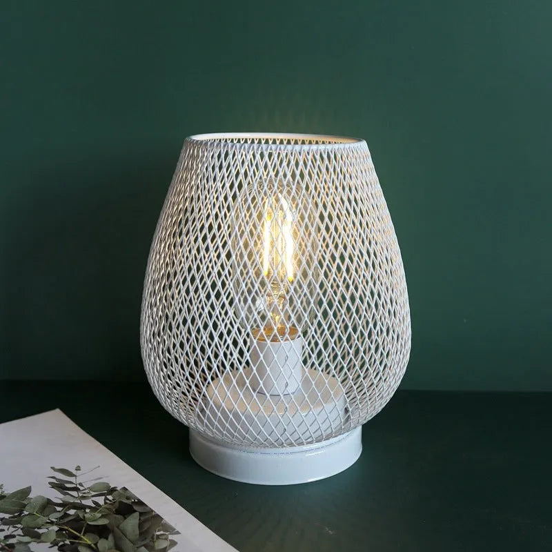 Retro iron art battery powered birdcage table lamp with warm light on bedside table