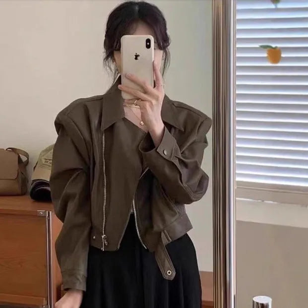 Brown women's retro slim fit leather-look jacket with pockets, short 40cm length.