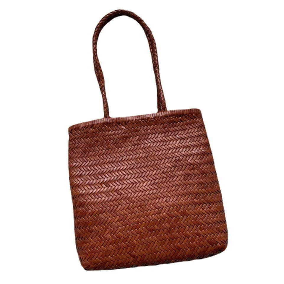 Brown handmade woven tote bag made of genuine cowhide leather with a three-dimensional pocket.