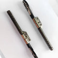 Pair of silver laptop screen hinge spindles for MacBook Pro 15-inch A1286 model.