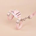 Pink, yellow, and blue bee-shaped adjustable cat leash with strap and hand rope on grass.