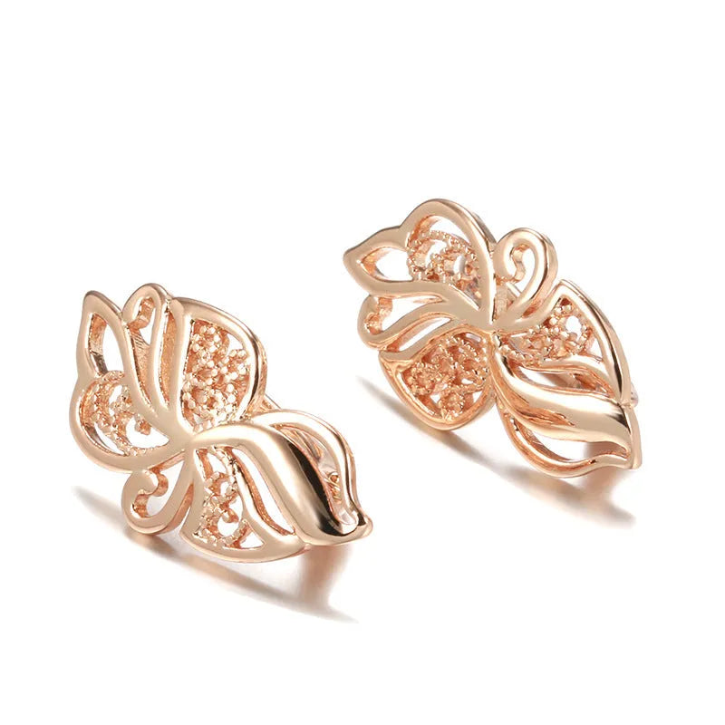 Rose gold geometric earrings for women with hollow carved copper design and rhinestone accents, one pair