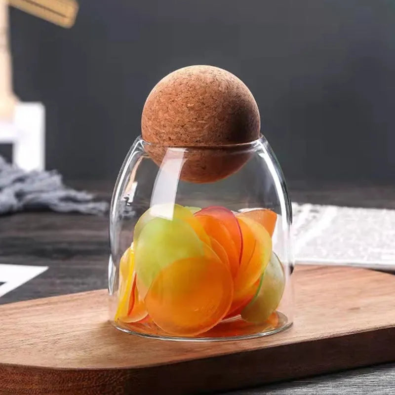 Set of three transparent spherical glass storage tanks with round single-layer design for general food storage