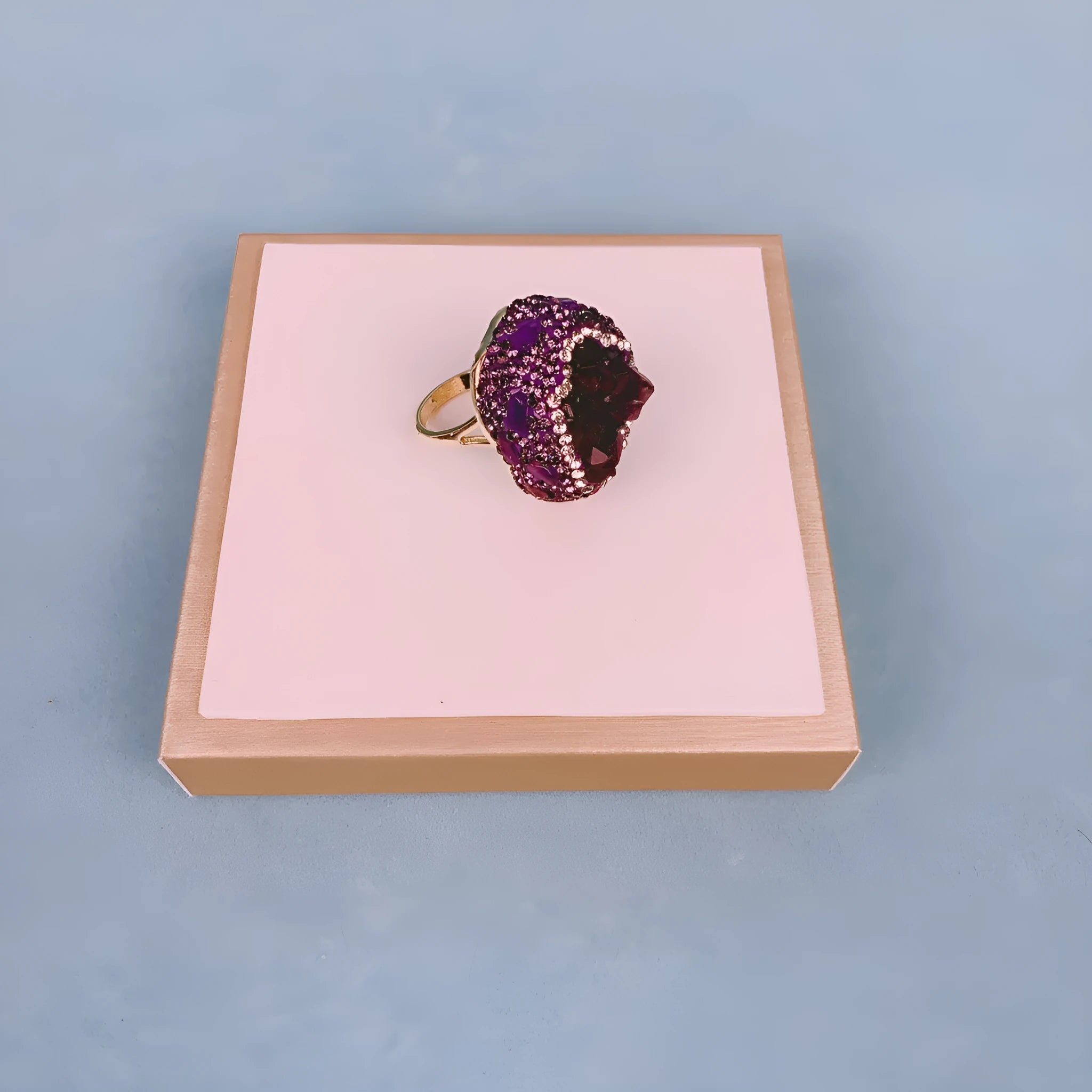 Natural Uruguay amethyst open adjustable ring in deep purple colour on a clean background