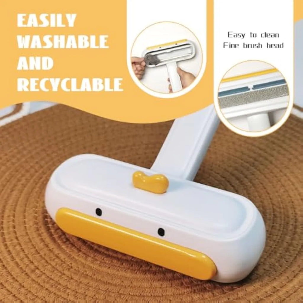 White portable pet hair remover brush with yellow duck cartoon design and polyester bristles.