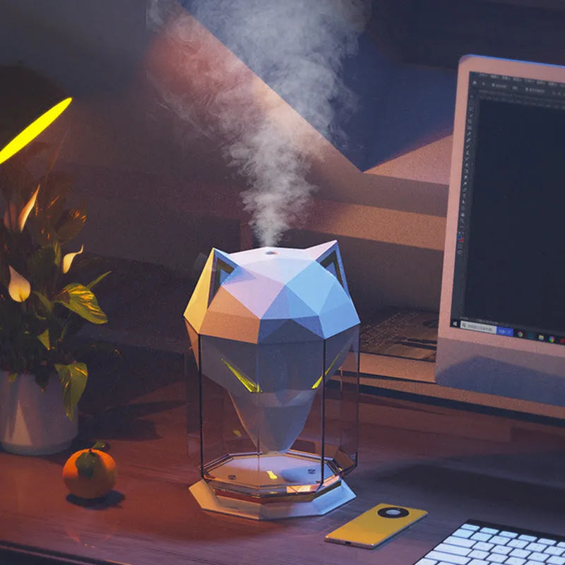 War Wolf ultrasonic air humidifier with colourful LED lights on desktop next to USB cable
