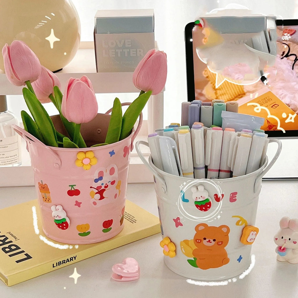 A round metal pen holder in a choice of colours for desktop stationery storage.