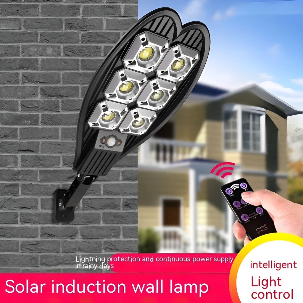 White 6-eye Sword design solar garden lamp with remote control on a grass lawn.