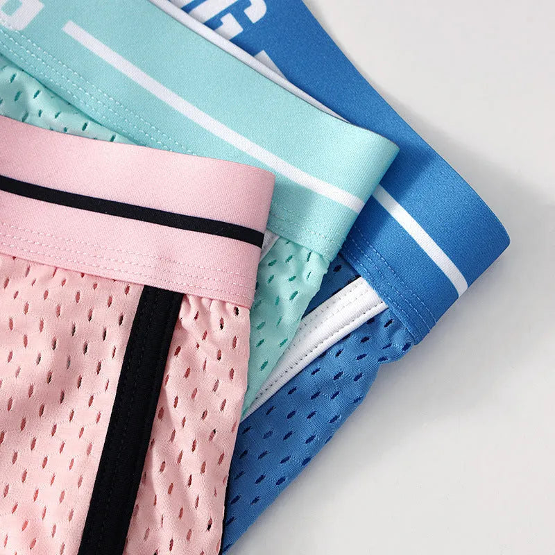 Men's solid colour Ice Silk nylon boxer shorts with a loose fit on a white background