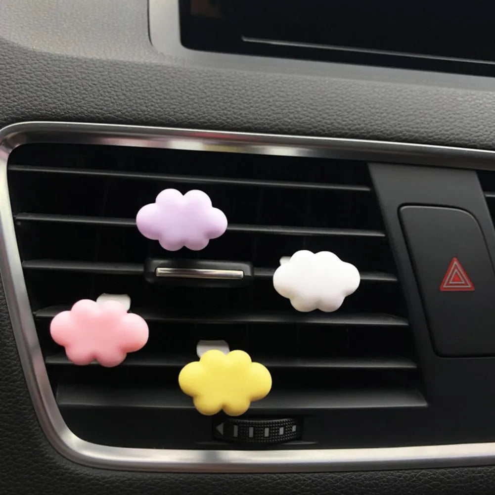 Resin Baiyun cartoon car air freshener clip in six colours on a car vent.