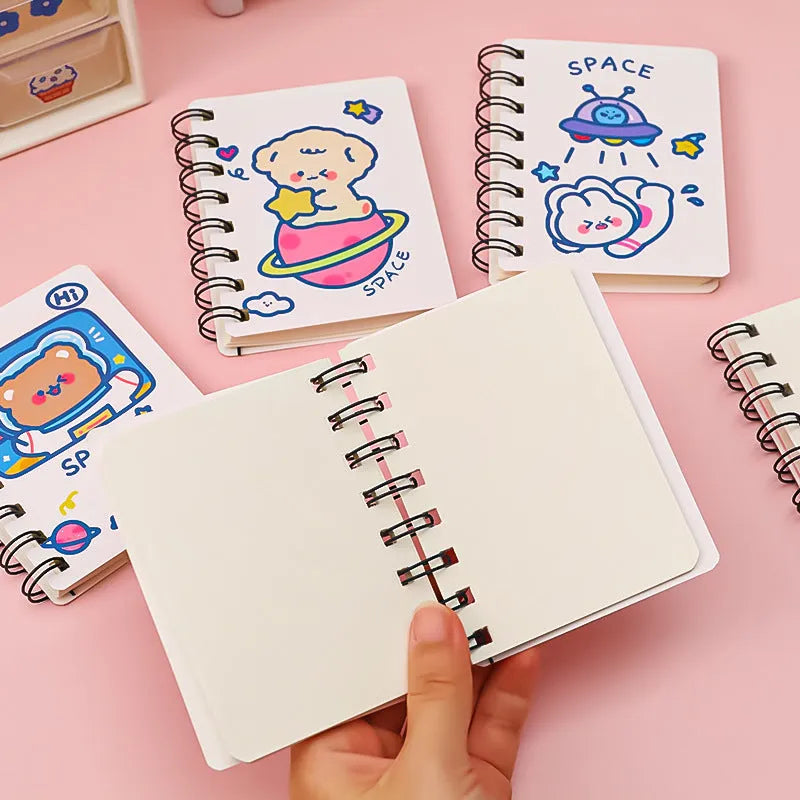 Astronaut Series portable pocket flipper notebook showing one of four cover designs: Astronaut Bear, Planet Teddy, Space Cat, or UFO.