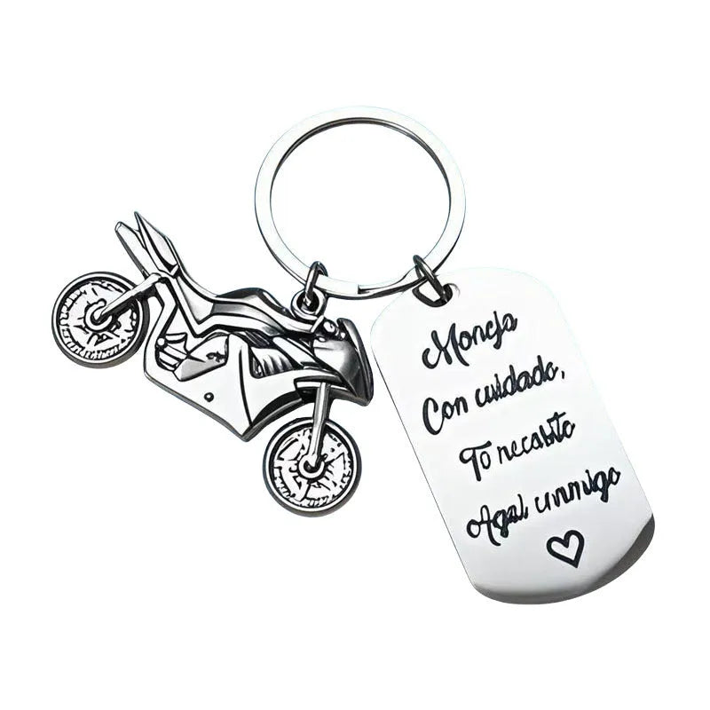 Stainless steel motorcycle keychain with minimalist design in a flannel gift bag.