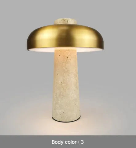 Modern alloy desk lamp with a rechargeable battery and touch-sensitive dimming switch on a wooden desk
