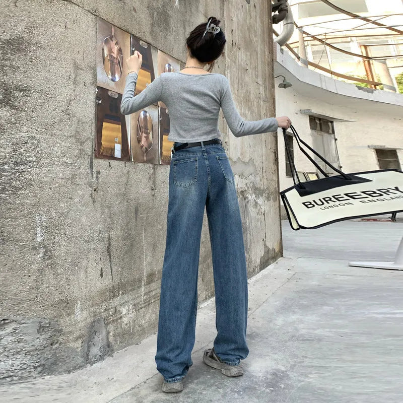 Women's retro blue straight-leg jeans with a high waist on a hanger.