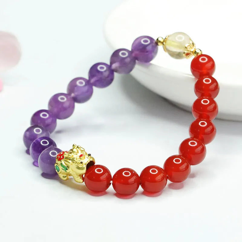 Purple amethyst and red agate beaded bracelet with Chinese style design on wrist