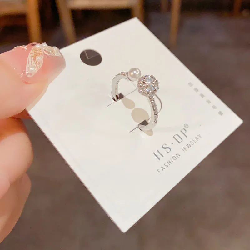 Round zircon open-end ring with gold plating on copper in gold or silver colour