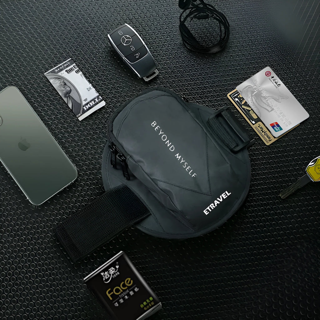 Black reflective running arm bag with adjustable strap, shown holding a mobile phone.