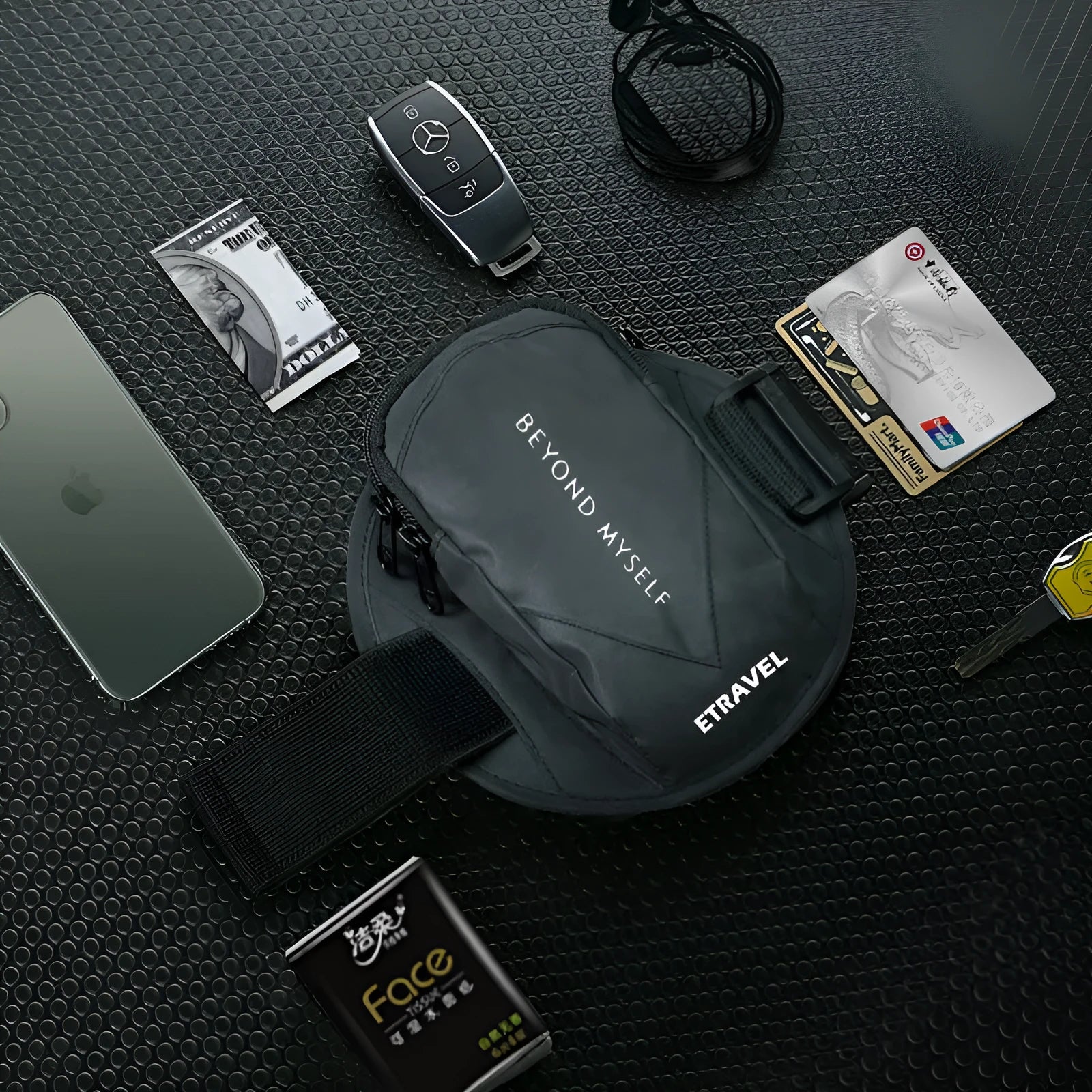 Black reflective running arm bag with adjustable strap, shown holding a mobile phone.