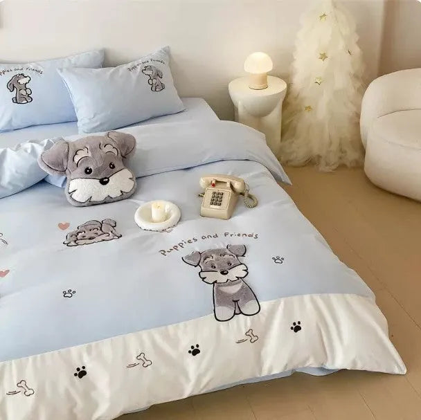 Cartoon Schnauzer design embroidered on a light blue cotton quilt cover and pillowcase.