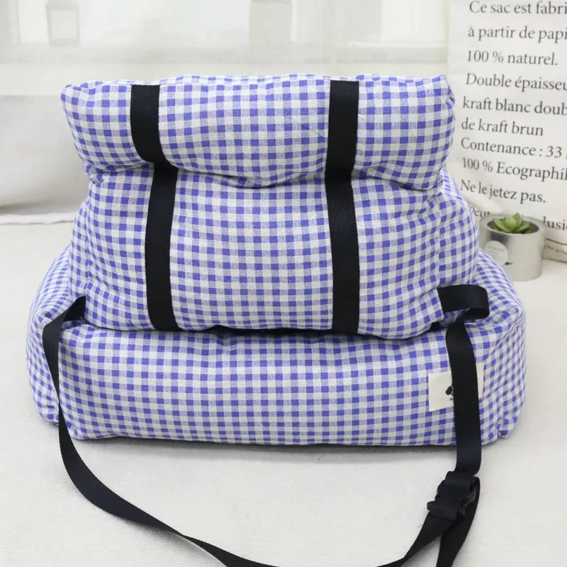 Grey and blue plaid cloth car-mounted dog travel nest shown in two size options.