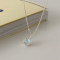 925 silver ornamental stone necklace with round geometric pendant on a curb chain.