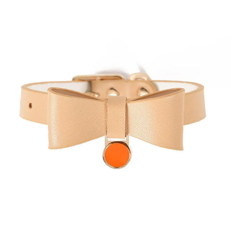 Brown leather adjustable cat collar shown on a neutral background.