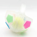 Football tennis ball shaped dog toy in white with black pattern for outdoor fetching