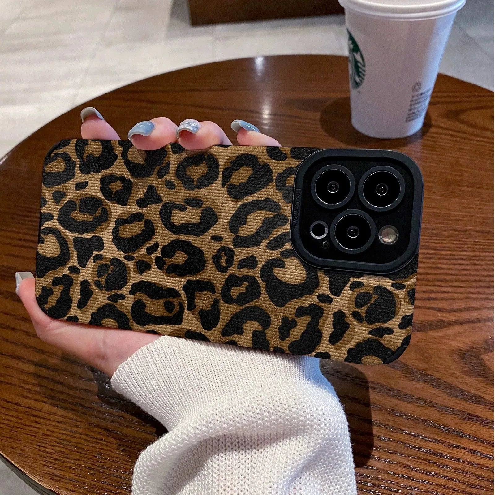 Gold leopard print all-inclusive imitation leather phone case for iPhone on a white background
