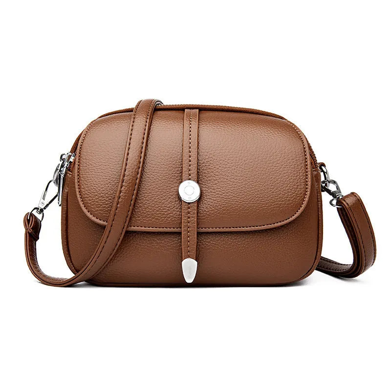 City Simple oval-shaped women's crossbody shoulder bag in khaki PU with sewing thread detail.
