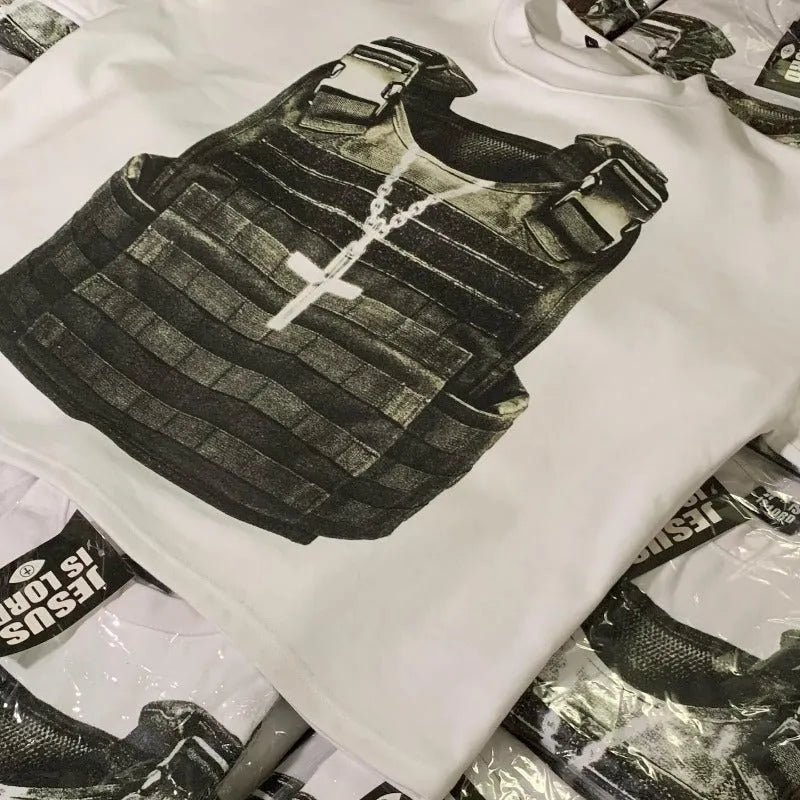 Person wearing a printed cotton short-sleeve pullover with a drop-shoulder design and retro graphic in a street hipster style.
