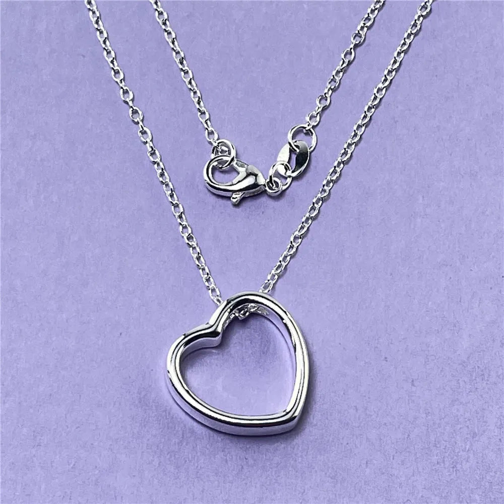 Silver heart necklace for women with 45.5cm chain and 2.6 x 2.8cm heart pendant in thick silver plating over copper.
