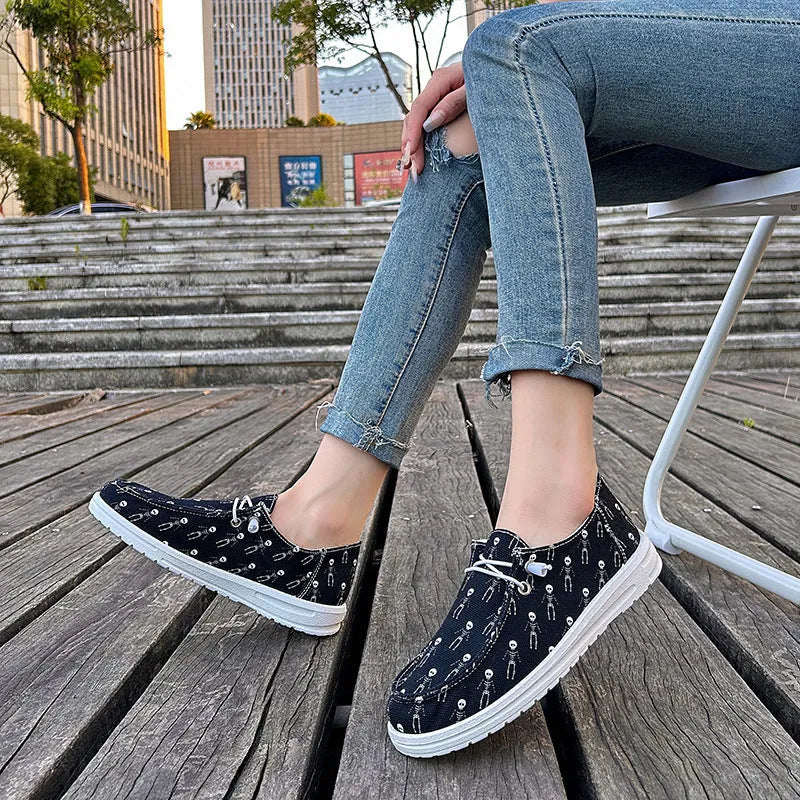 Women's black canvas low-top soft sole shoes on display, showing side view, plus size range 37-42