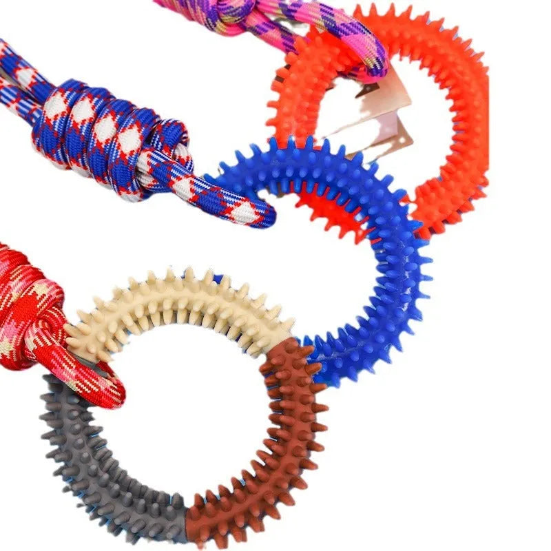 Colourful blue braided rope knotted dog chew toy on a white background.
